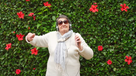 Old-woman-dancing-with-headphones-on