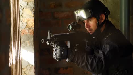 side view of caucasian soldier aiming with a rifle during military exercise at base 4k