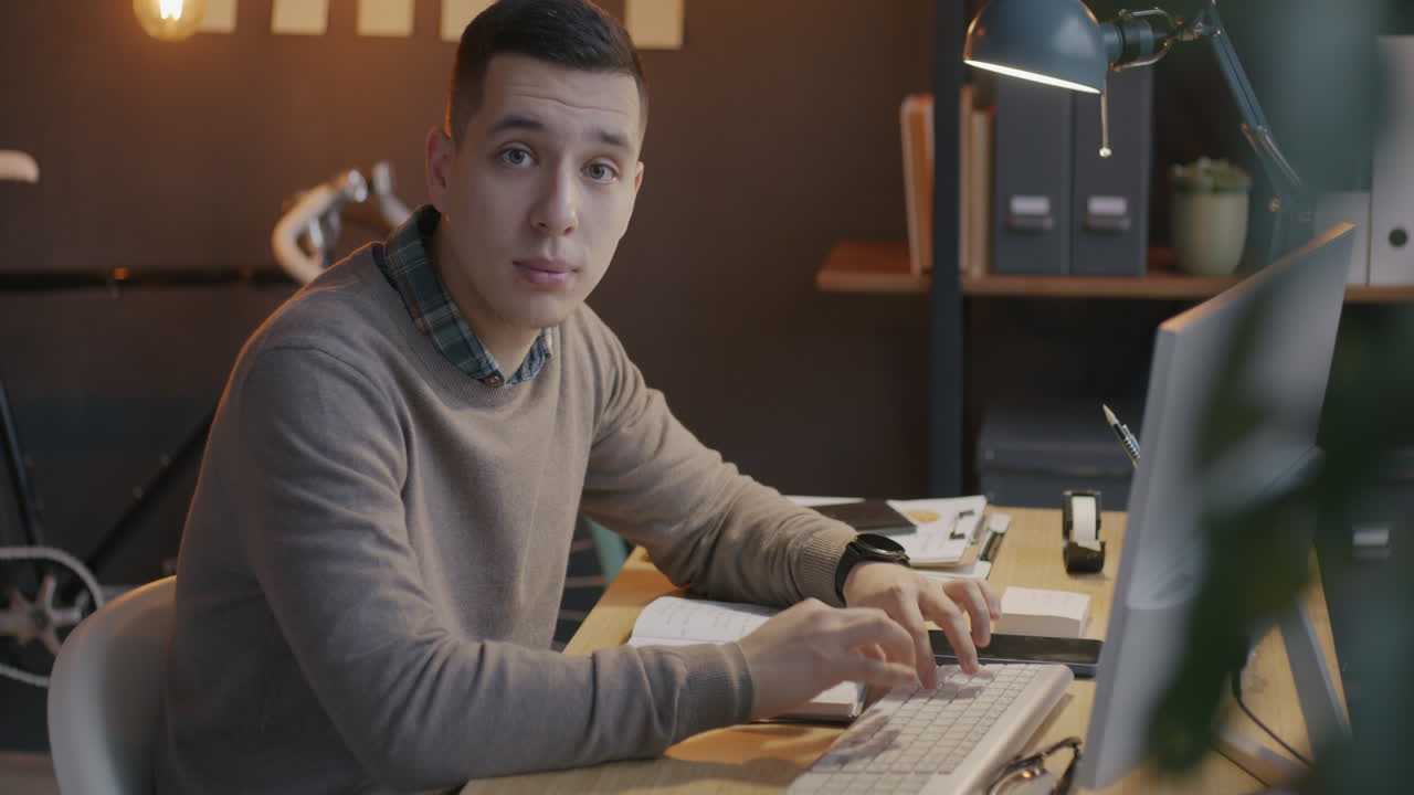 Man Working at his Computer in the Office