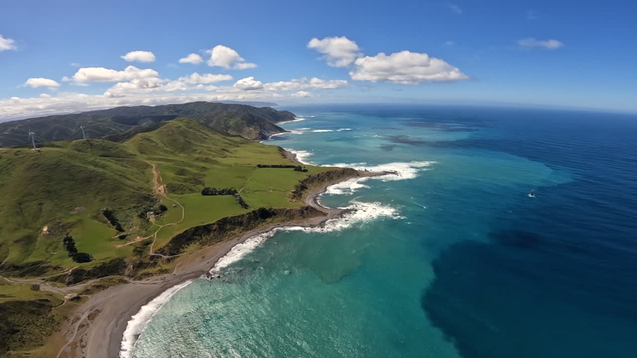 Aerial shot flying along the North island coastline towards Wellington, New Zealand
