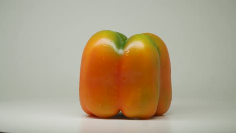 a yellow bell pepper on pure white white background - close up shot