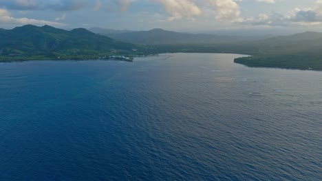 Calm-and-blue-waters-of-Maimon-Bay-at-dusk,-Puerto-Plata-in-Dominican-Republic