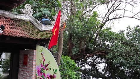 vietnamese flag waving at hanoi temple