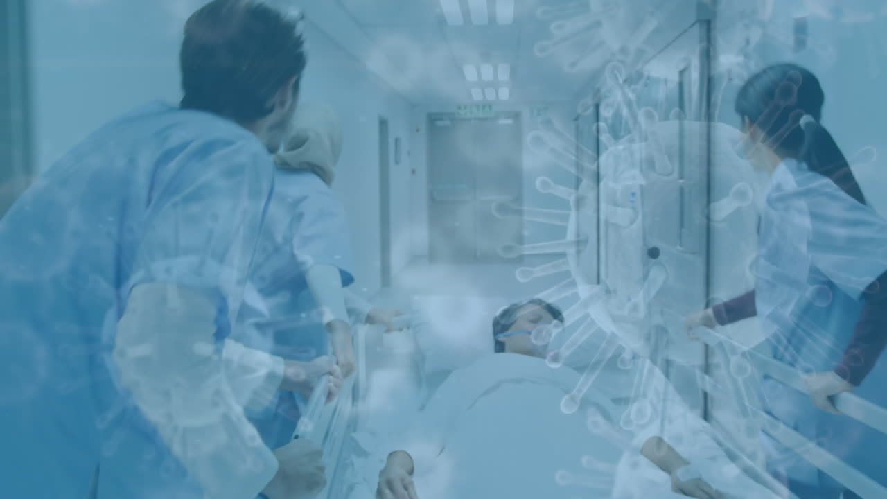 células de covid-19 moviéndose contra los médicos rodando una cama en el hospital