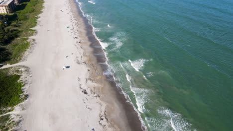 Tourists-on-Vacation-Enjoying-Sunny-Florida-Beach-in-Cocoa,-Aerial