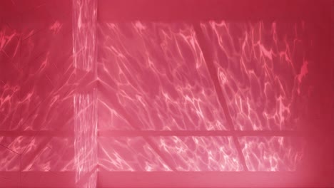 Serenity-in-Red:-Light-Patterns-on-a-Pool’s-Surface-vertical