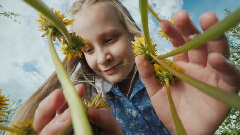 Portrait-Of-A-Funny-Child-Looking-At-The-Flowers-In-The-Meadow