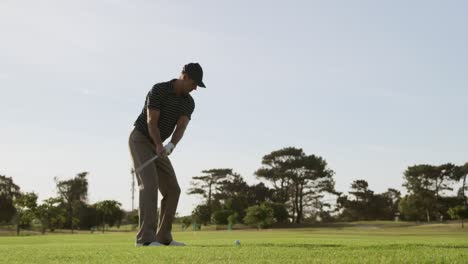 Golf-player-hitting-the-ball-with-his-club