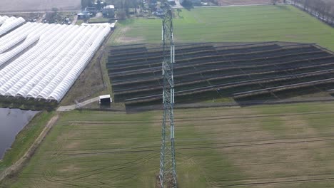 power pole utility electricity line solar farm tunnel foil aerial view