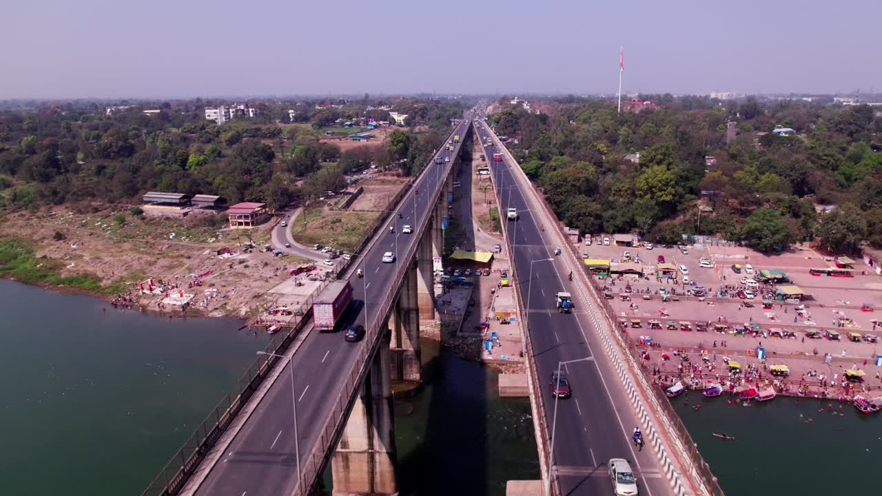 Tilwara Narmada River Bridge with Narmada Ghat and national flag at Jotpur, Jabalpur, Madhya Pradesh, india. day time, push back, drone shot, 4k.