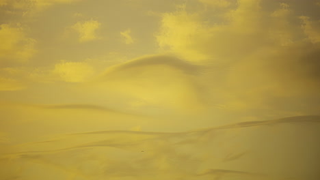 Dramatic-Timelapse-of-Clouds-in-Yellow-Sky
