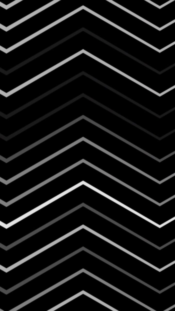 Animation of white and grey zigzag shapes moving over black background