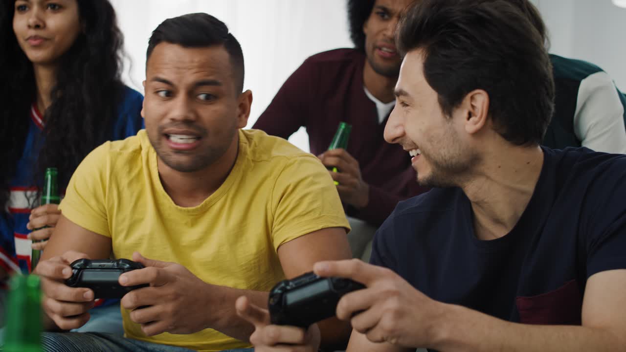 Tracking video of  friends having fun while playing a game console
