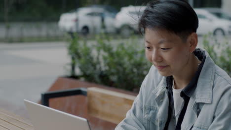 woman working on a laptop outdoors