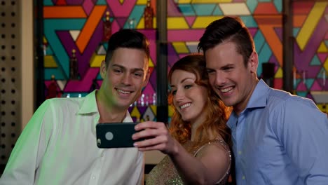 friends taking selfie from mobile phone