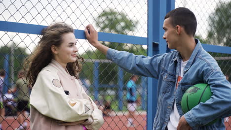 teenagers talking outdoors