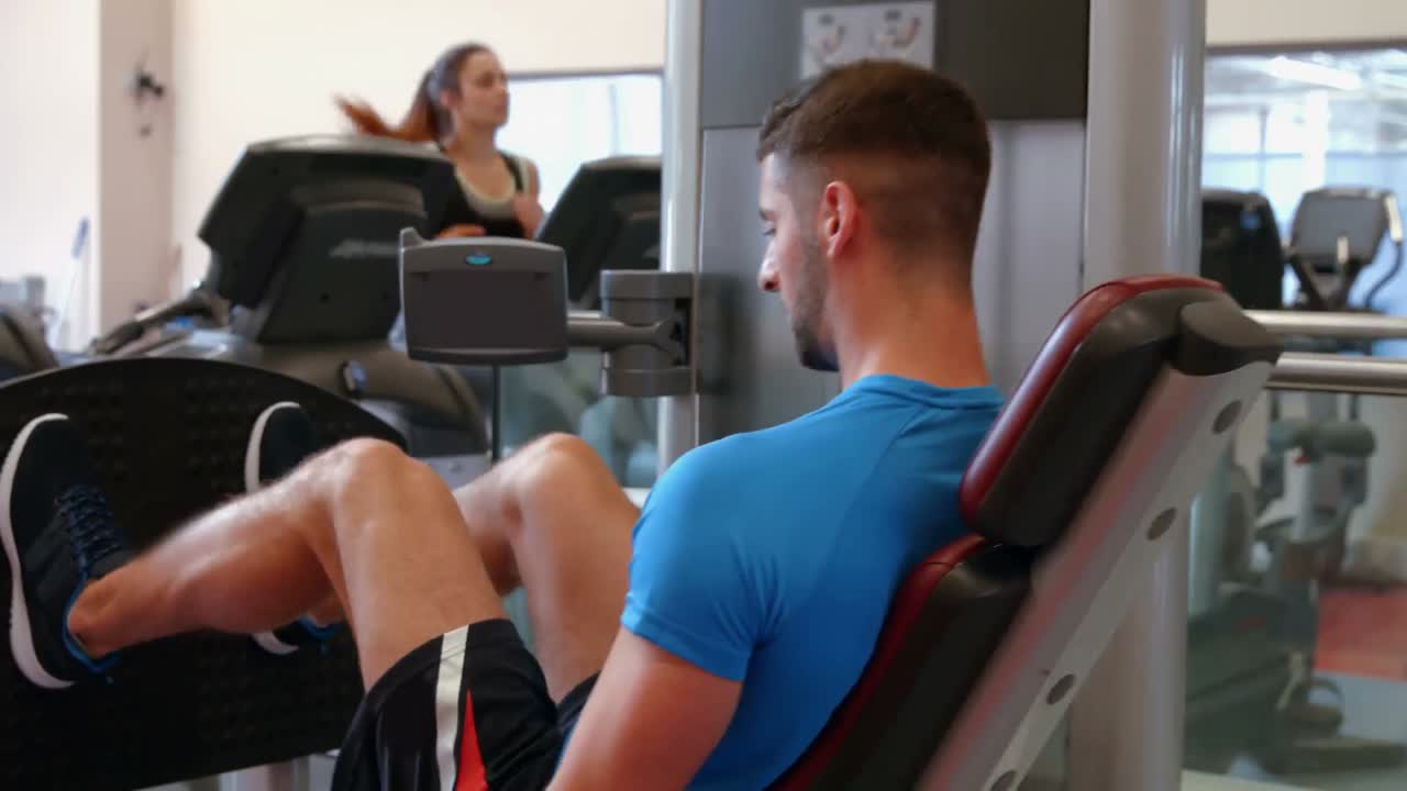 Man using weights machine in gym