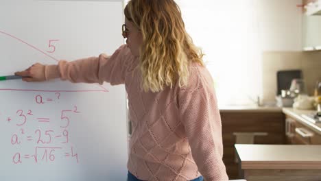 tracking video of young female teacher explains math tasks