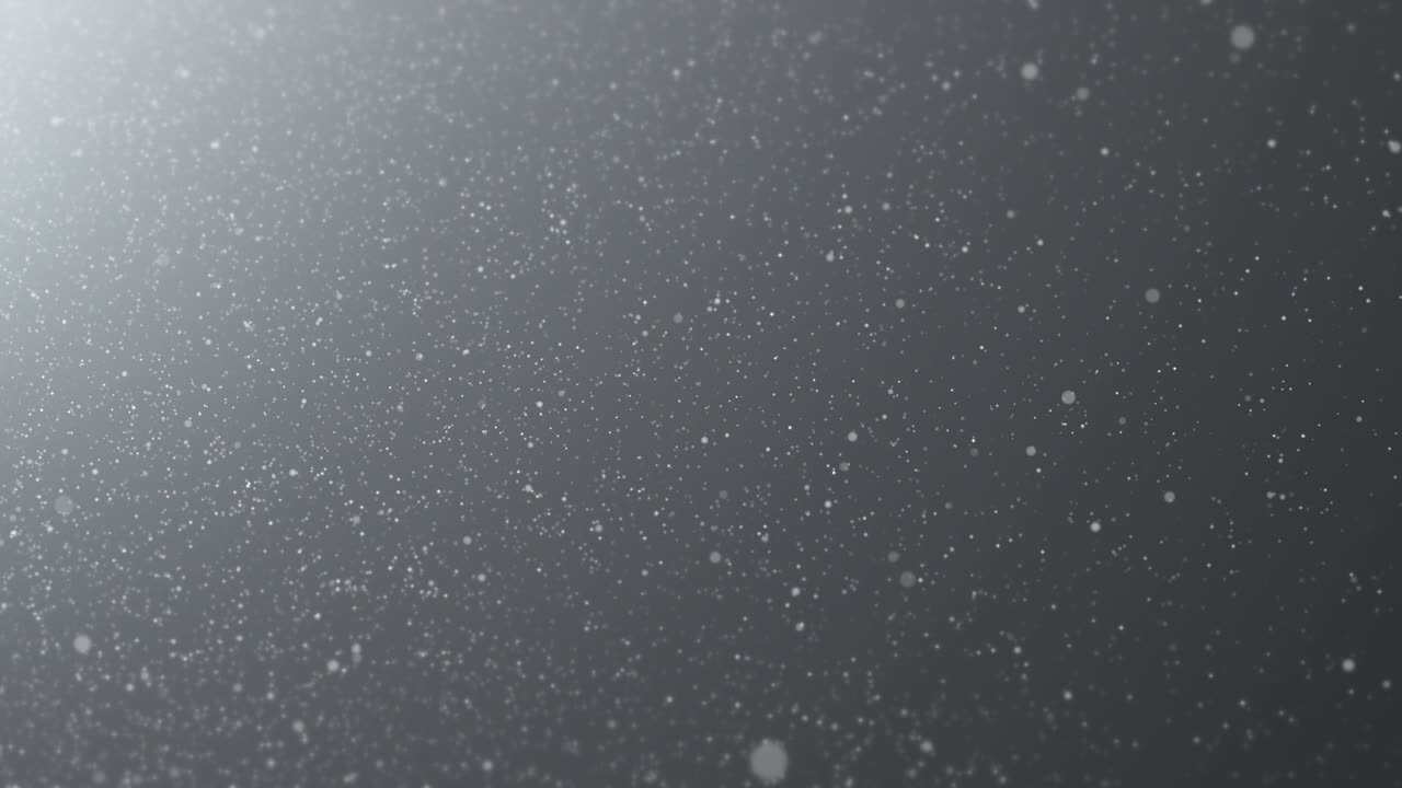 Dust particles slow motion on a black background. 4k seamless loop