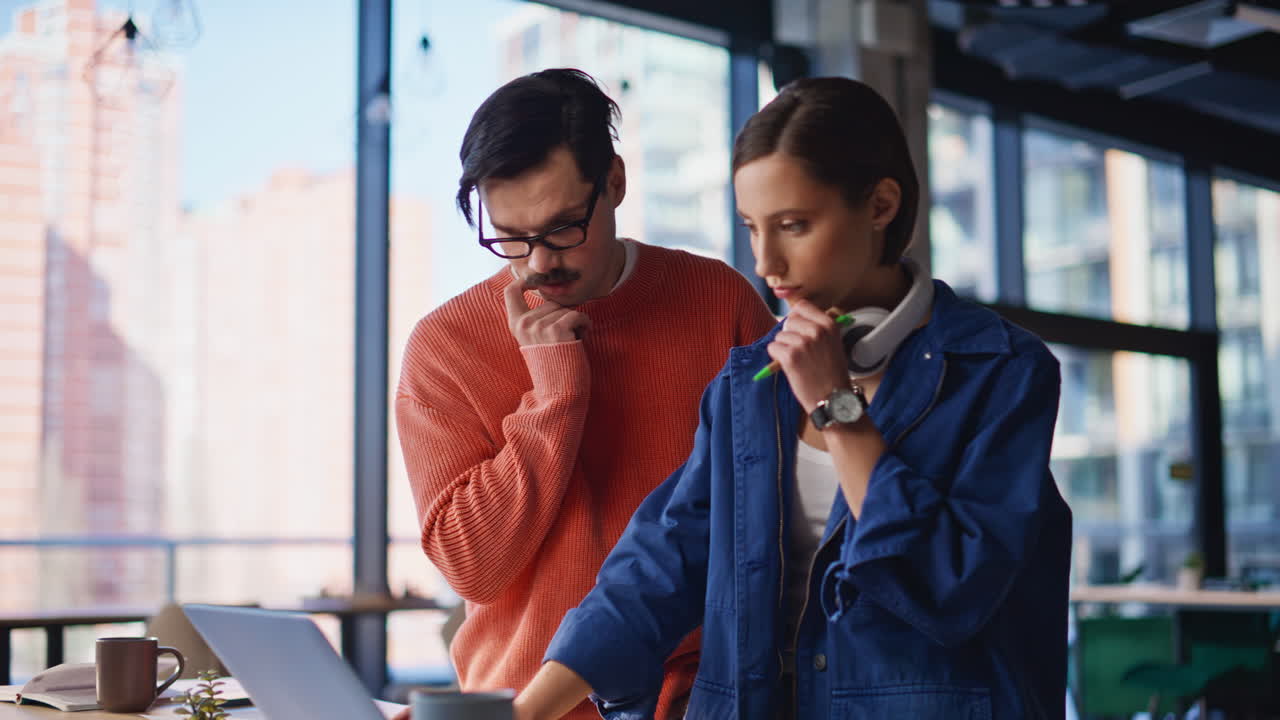 Team employees pondering strategy for business developments in office closeup