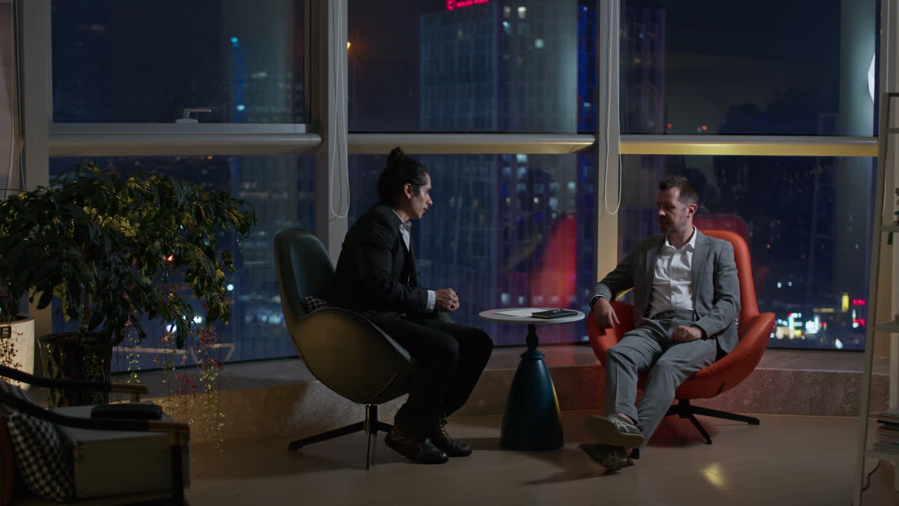 Business Meeting at Night in High-Rise Office