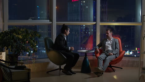 business meeting at night in high-rise office
