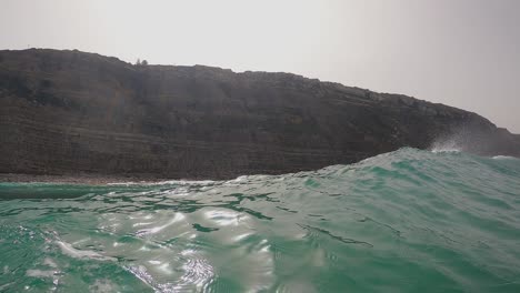 Surfer-surfing-ocean-wave-in-Aguda-beach-Portugal