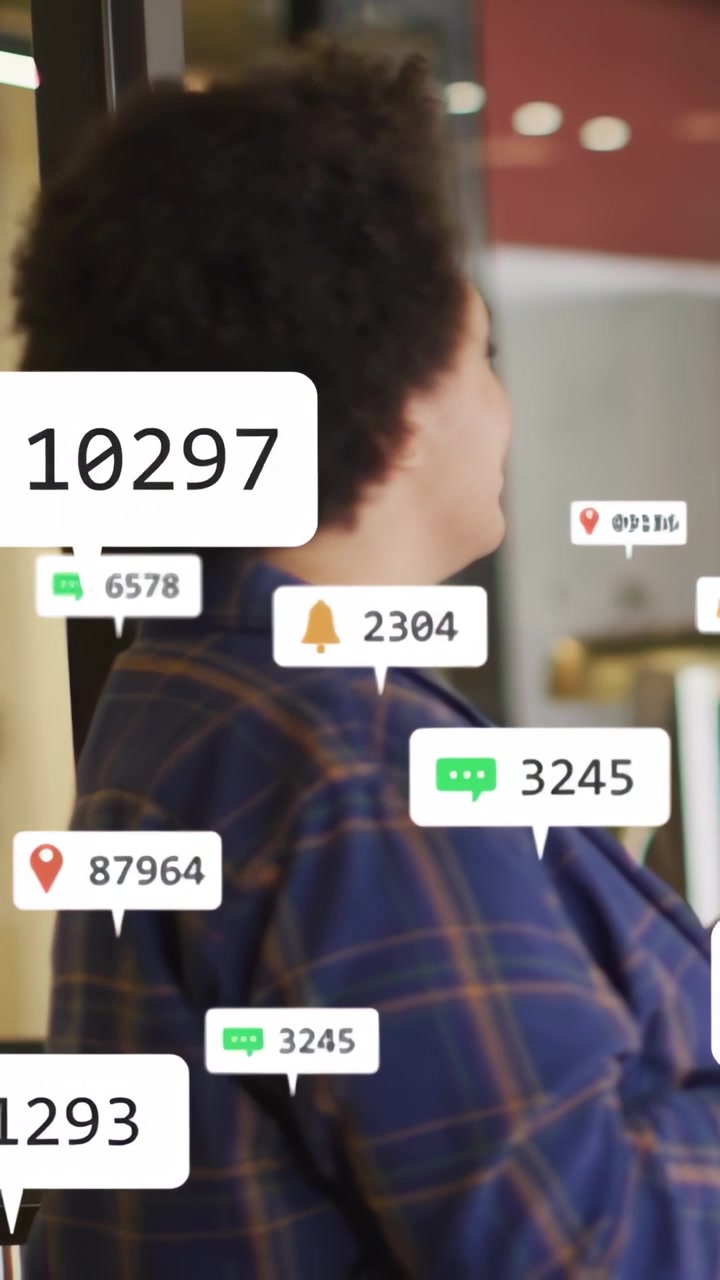 Vertical video: Woman by glass turning raising hand laughing as notifications popping for marketing