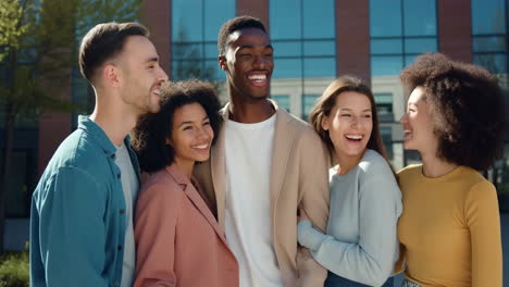 diverse young adults laughing together outdoors