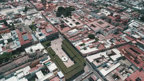 view of garden and church in downtown queretaro in mexico