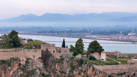 rotating drone view of fortress of akronauplia and nafplio city in peloponnese region, greece