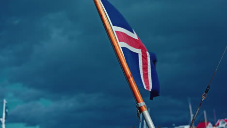 icelandic national flag waving on maritime vessel