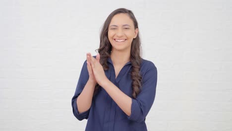 Happy-Indian-girl-clapping-and-cheering