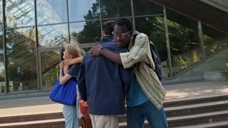 students talking outside university building