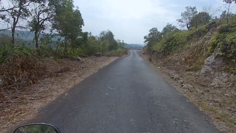 motorcycle-rider-ridding-bike-in-forests-trails-at-day-from-flat-angle