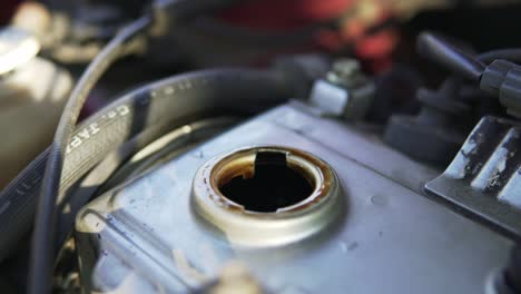 man hands checking car oil level