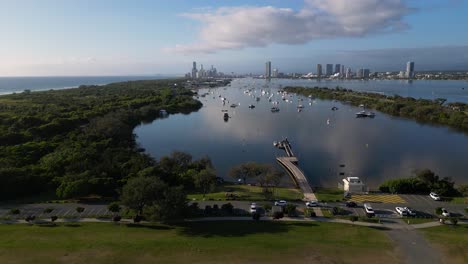 reversing aerial facing south over the broadwater looking towards surfers paradise, gold coast, australia.