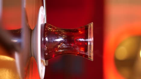 elegant glass of amber spirit in a bar setting