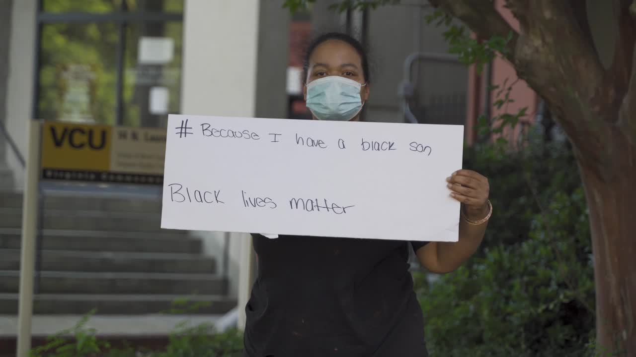 Black Mother Holding Sign Up For Black Lives Matter