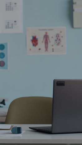 a medical office with a laptop on a desk