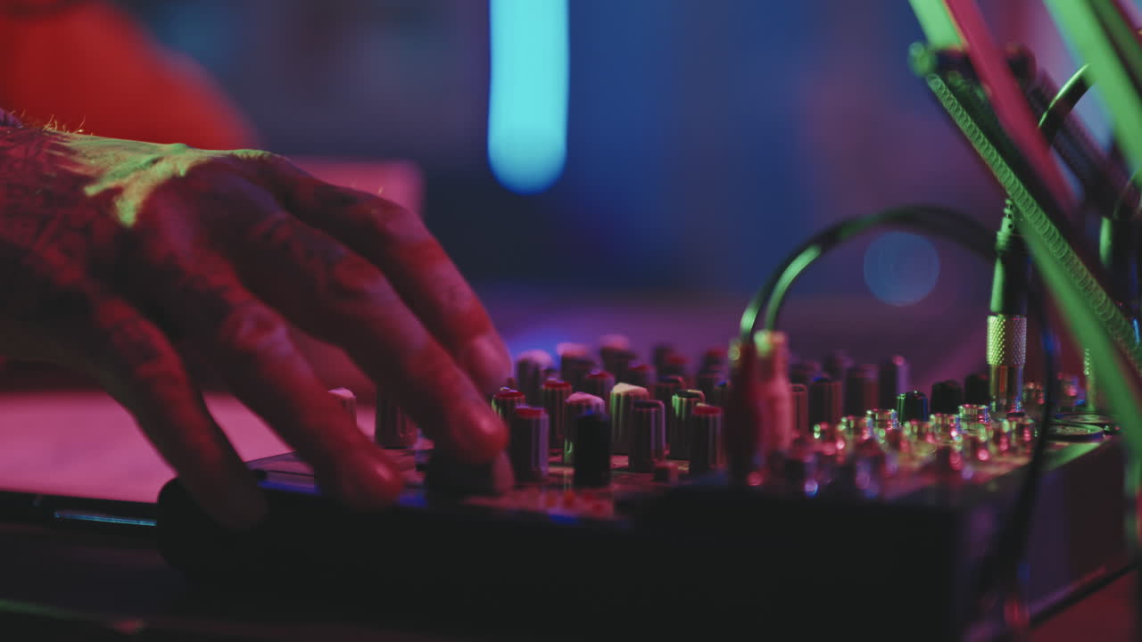 Unrecognizable Music Producer Using Audio Mixer