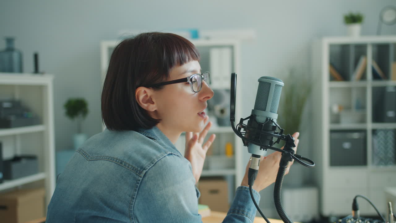 Woman Recording Podcast or Interview in a Studio