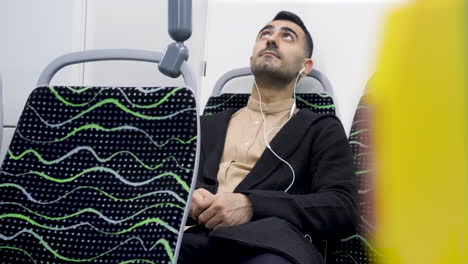 man sleeping on a bus