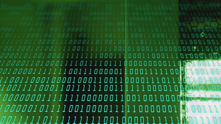 Binary code animation over shadowy figure in green background