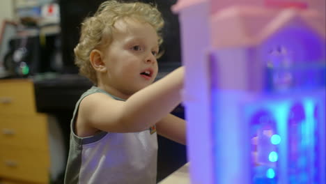 happy little boy plays with toy helicopter