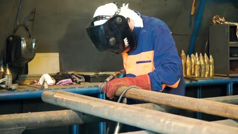 industrial metalworker welding and repair