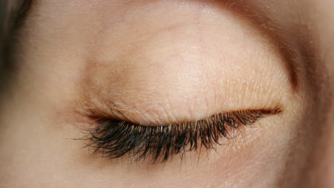 closeup of woman with green and blue eyes