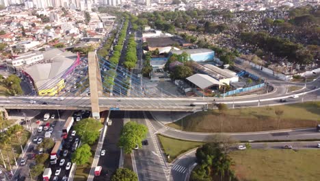 a drone shot of highway multilevel junction interchange road in urban populated area
