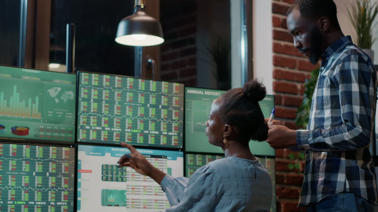 Man and woman doing teamwork to develop hedge fund trade