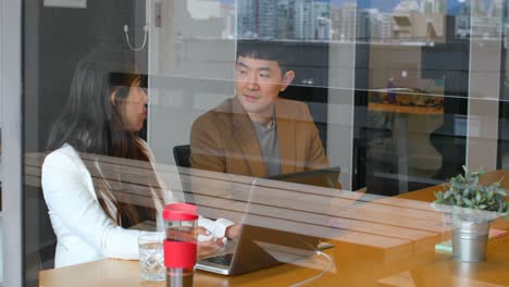 young asian business people interacting with each other in office 4k